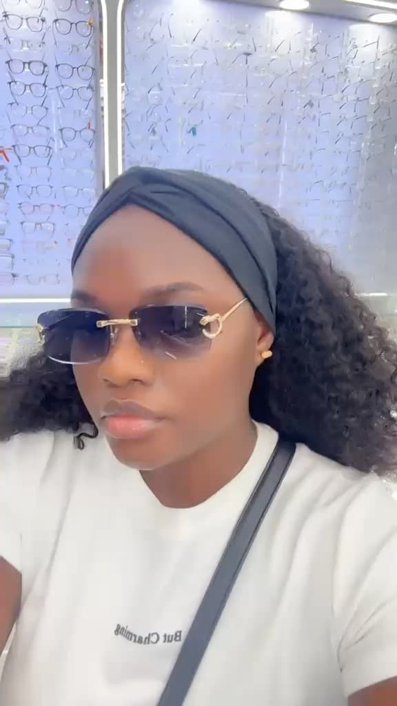 Yetunde wearing YETTYSHADES in the showroom